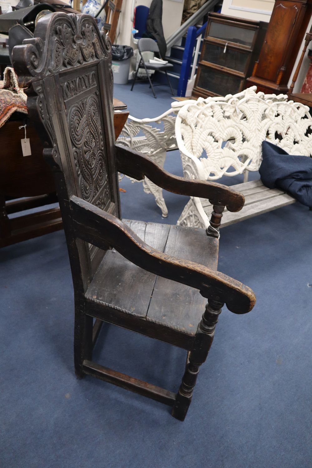 A Charles I oak panel back Wainscot chair, the central panel carved JOHN LUND 1636, some alterations, width 57cm height 111cm